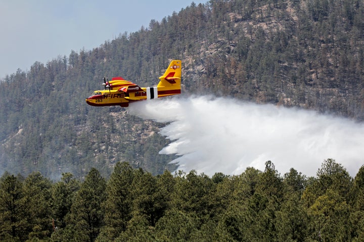 One of Bridger Aerospace's aircraft, known as a "super scooper," battles the Hermits Peak and Calf Canyon Fires in the Santa Fe National Forest in New Mexico in April 2022.