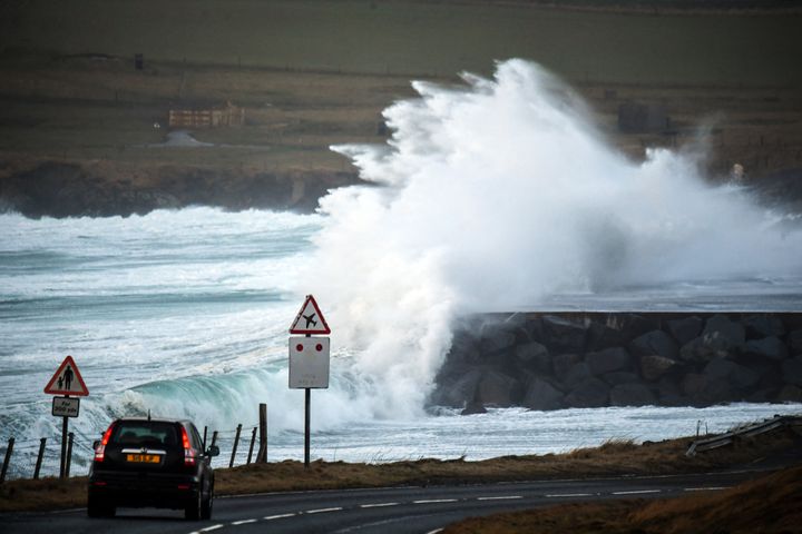 Waves break over the end of the runway at Sumburgh Airport in Sumburgh, Shetland Islands, as severe weather from Storm Ingunn affects flights and ferry travel.
