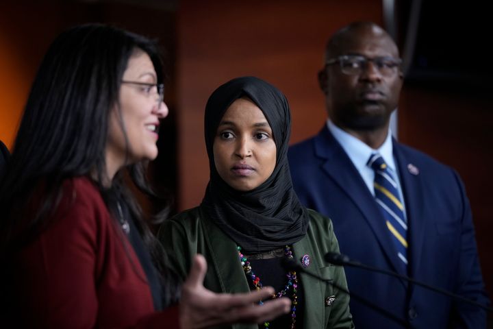 Rep. Rashida Tlaib (D-Mich.), left, speaks as Reps. Ilhan Omar (D-Minn.) and Jamaal Bowman (D-N.Y.) look on. Omar and Bowman are top t