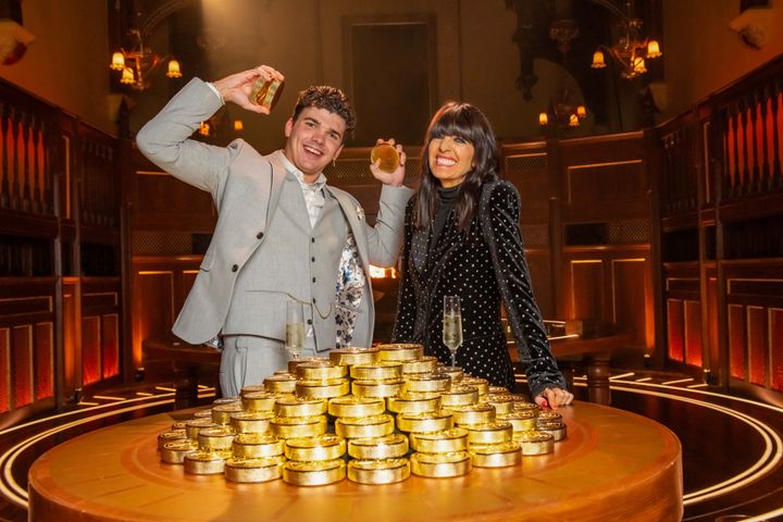 Harry celebrating his win with Traitors host Claudia Winkleman