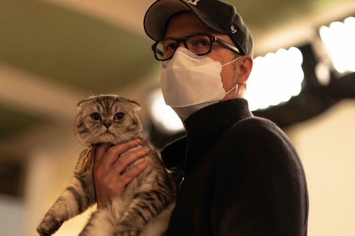 Director Matthew Vaughn with the film's break-out star... a very cute cat