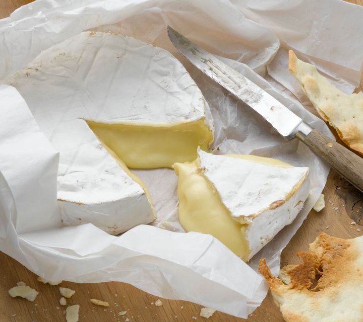 The white rind on a wheel of brie is a type of mold that's safe to eat. 
