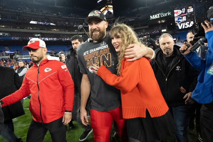 Kansas City Chiefs tight end Travis Kelce and Taylor Swift walk together after the Chiefs' win over the Baltimore Ravens.