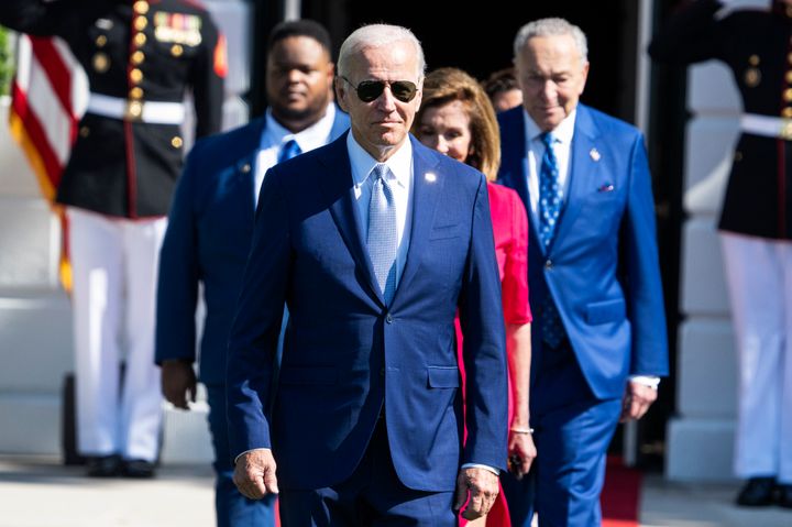 President Joe Biden, House Speaker Nancy Pelosi (D-Calif.) and Senate Majority Leader Charles Schumer (D-N.Y.) arrive for the CHIPS and Science Act of 2022 bill signing on the South Lawn of the White House, Aug. 9, 2022.