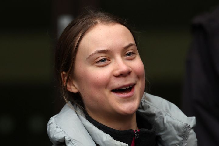 Greta Thunberg laughs as she and fellow defendants and supporters return to Westminster Magistrates Court in London on February 2, 2024. (Photo by Daniel LEAL / AFP) (Photo by DANIEL LEAL/AFP via Getty Images)