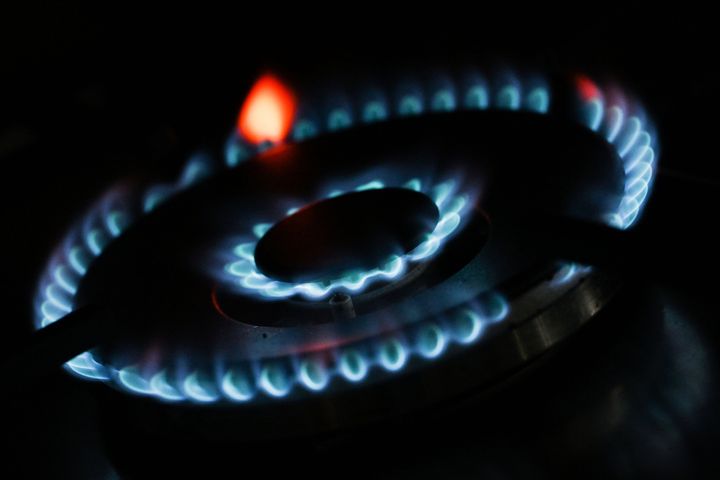 Flames can be seen on a gas stove.