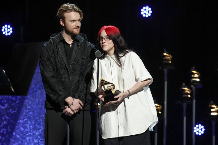 Finneas and Billie Eilish on stage at the Grammys