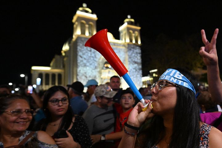 Supporters of Salvadoran President Nayib Bukele gather outside the National Palace to celebrate his re-election during the presidential and legislative elections in San Salvador on February 4, 2024. (Photo by Marvin RECINOS / AFP)