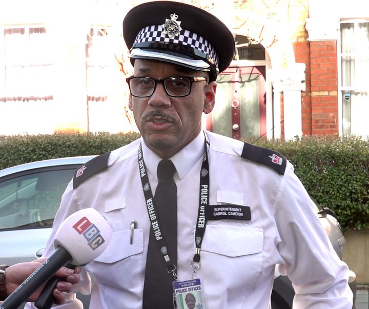 Superintendent Gabriel Cameron reading a statement to the media on Lesser Avenue, near Clapham Common, south London.