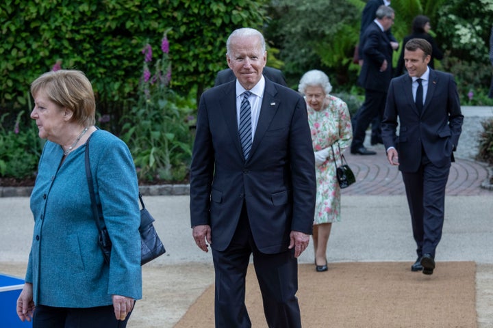 Joe Biden -- with German Chancellor Angela Merkel, front, while Queen Elizabeth II and French President Emmanuel Macron trail -- at the G7 event in June 2021 that the U.S. president erroneously spoke about.
