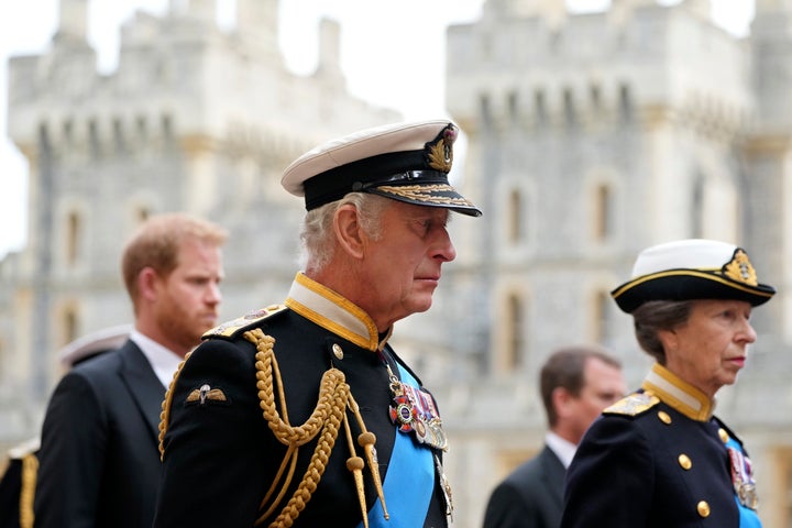 King Charles III, Princess Anne, right, and Prince Harry, left, follow the hearse with the coffin of Queen Elizabeth II moving towards St. George's Chapel at the Windsor Castle, in Windsor, England, Monday Sept. 19, 2022. (AP Photo/Jon Super, Pool)