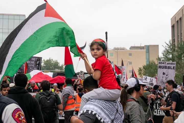 A young girl holds a Palestinian flag at the Texas State Capitol as demonstrators rally in support of Palestinians in Austin on Nov. 12, 2023. A protest last weekend near the University of Texas campus was followed by the stabbing of a young Palestinian American.