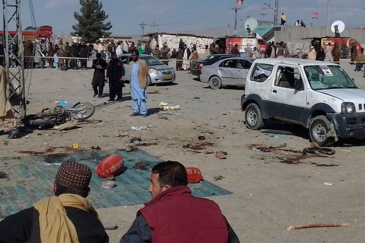 Security officials examine the scene of a bomb blast in Khanozai, Pashin, a district of Pakistan's Baluchistan province, on Feb. 7, 2024. 
