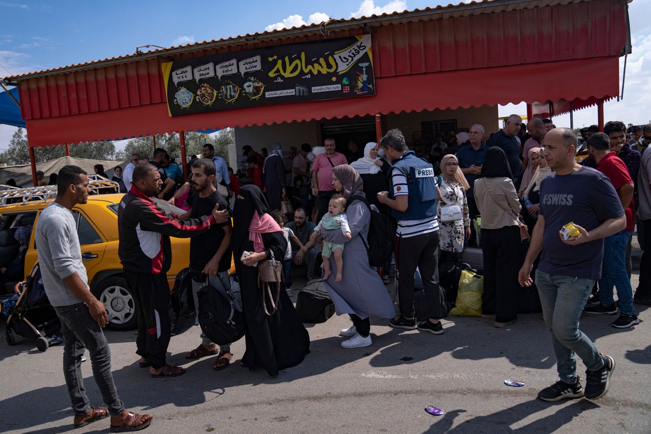 Palestinians wait to cross into Egypt at the Rafah border crossing in the Gaza Strip, on Oct. 16, 2023, trying to find refuge from Israel's relentless bombardment in retaliation for Hamas' brutal Oct. 7 attack.