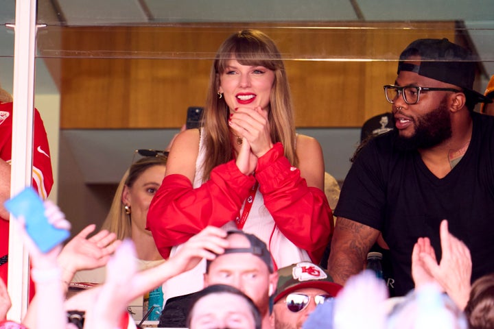 Swift cheers from a suite as the Kansas City Chiefs play the Chicago Bears at GEHA Field at Arrowhead Stadium on Sept. 24, in Kansas City. 