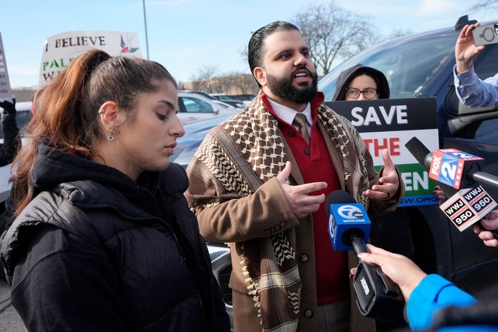 Imran Salha (center), imam of the Islamic Center of Detroit, and Lexis Zeidan (left) address the media before joining about three dozen people in Dearborn, Michigan, on Thursday as they protested Israel's attacks in Gaza. The protesters had hoped to be heard by members of the Biden White House who were scheduled to meet with Muslim and Arab American leaders.