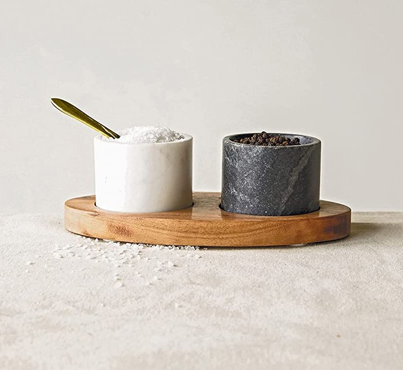 A salt and pepper marble wood tray