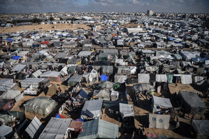 Families shelter in makeshift tents on Feb. 9 as they struggle to find clean water, food and medicine while Israeli attacks continue in Rafah.