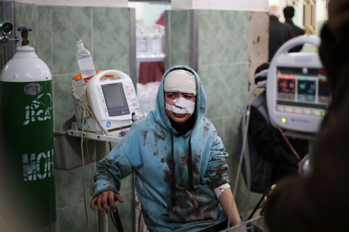 A Palestinian wounded in the Israeli bombardment sits in a hospital In Rafah, Gaza Strip, Saturday, Feb. 10, 2024. (AP Photo/Hatem Ali)
