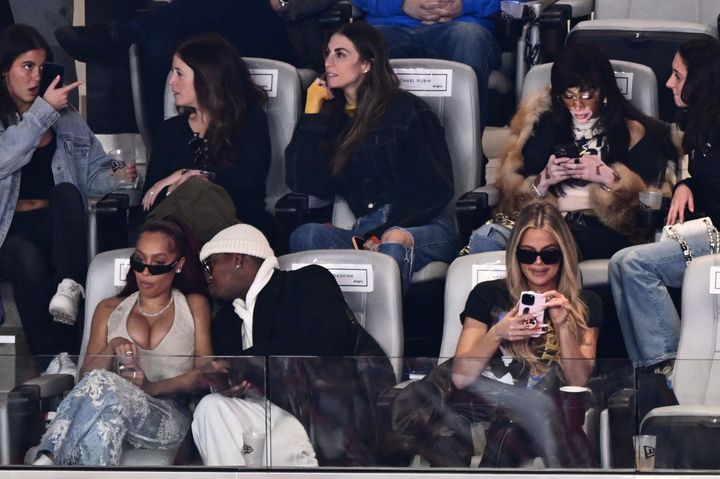 La La Anthony (left), Khloe Kardashian (right) and model Winnie Harlow (top right) seemed to have their attention away from the game.