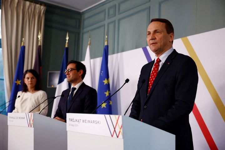 German Foreign Minister Annalena Baerbock, French Foreign and European Affairs Minister Stephane Sejourne and Polish Foreign Minister Radoslaw Sikorski (L to R) attend a joint press conference near Paris on February 12, 2024.