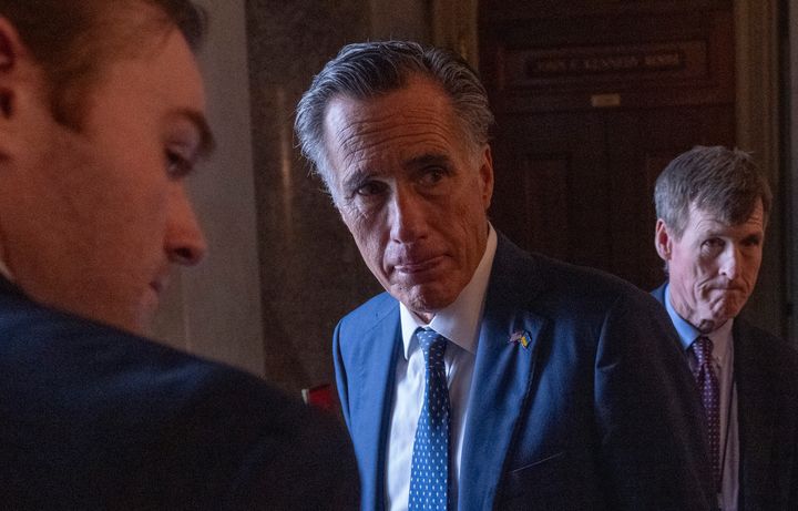 Sen. Mitt Romney (R-Utah) speaks to reporters Sunday as the Senate works through the weekend on a $95.3 billion foreign aid bill that includes support for Ukraine, Israel and Taiwan. The fate of the aid package in the House is in doubt.