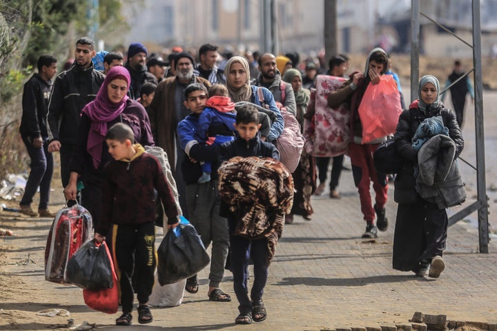 Palestinians leave the area of Nasser Hospital and the adjacent schools in Khan Younis in the southern Gaza Strip on January 29, 2024, after the Israeli army ordered people to immediately evacuate certain parts of the city.