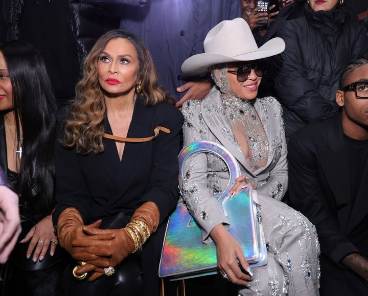Beyoncé, right, sits next to mother Tina Knowles at a Luar show during New York Fashion Week in New York City.