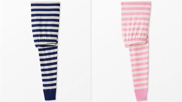 Two pairs of the iconic Hanna Andersson striped pajamas.