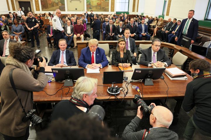 Former President Donald Trump, center, sits in the courtroom before the start of closing arguments in his civil business fraud trial at New York Supreme Court on Jan. 11. The New York judge ruled against Trump on Friday.