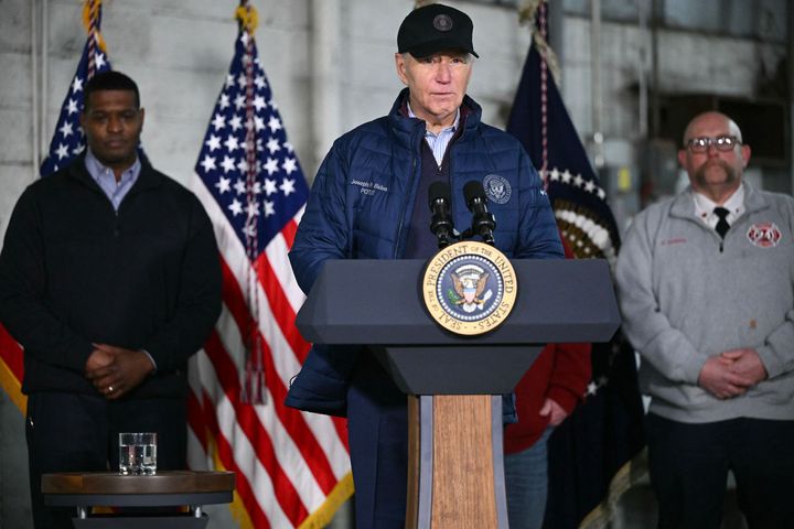 President Joe Biden speaks Friday after receiving an operational briefing on the continuing response and recovery efforts at the site of a train derailment that spilled hazardous chemicals a year ago in East Palestine, Ohio. With Biden are Environmental Protection Agency Administrator Michael Regan (left) and East Palestine Fire Chief Keith Drabick.
