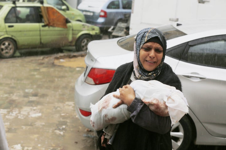 (EDITORS NOTE: Image depicts death) Relatives mourn for their loved ones killed in Israeli attacks after their bodies were brought to Al Aqsa Hospital in Deir al-Balah, Central Gaza on February 18, 2024.