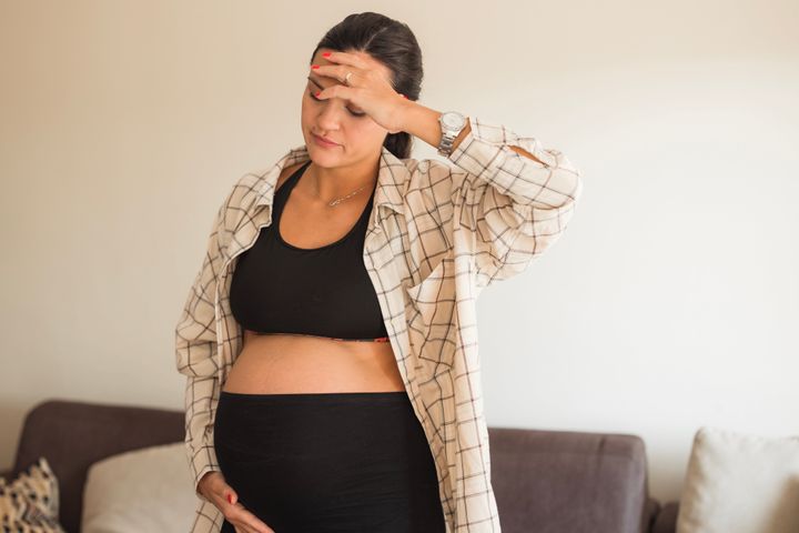 Pregnant woman home alone with a headache