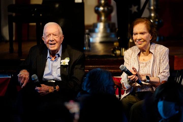 Former President Jimmy Carter and his wife former First Lady Rosalynn Carter sit together during a reception to celebrate their 75th anniversary on July 10, 2021, in Plains, Ga.