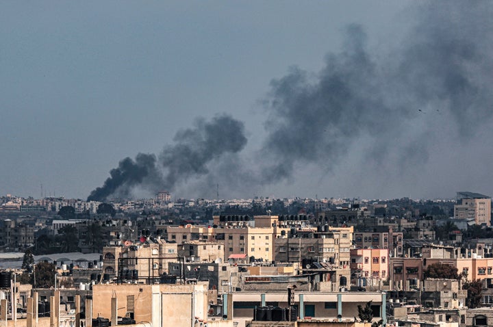 This picture taken from Rafah shows smoke billowing over Khan Yunis in the southern Gaza Strip during Israeli bombardment on Feb. 20, 2024, amid continuing battles between Israel and the Palestinian militant group Hamas.