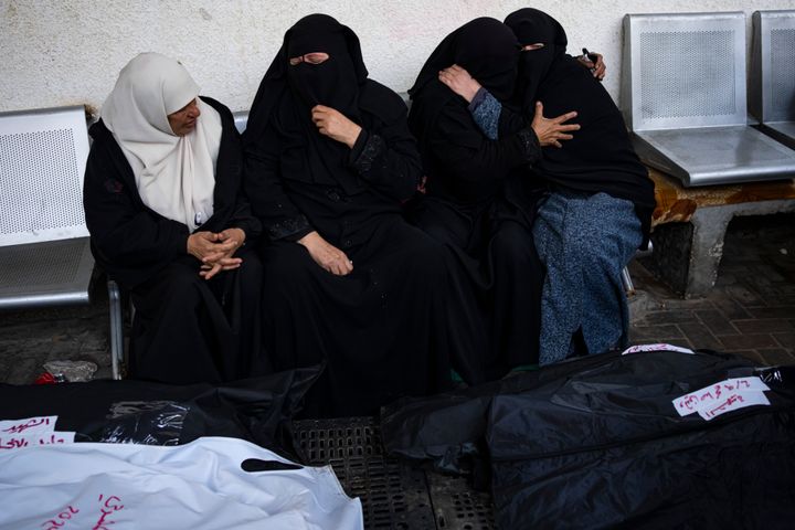 Palestinians mourn relatives killed in the Israeli bombardment of the Gaza Strip at a hospital in Rafah, on Feb. 9, 2024.