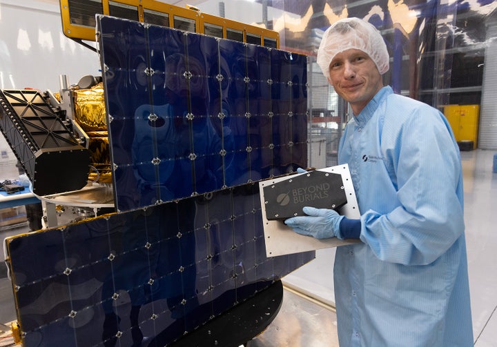 Beyond Burials CEO Dan Peabody prepares a 10-inch-long coffin-shaped payload container with Lee Speigel's cremated remains in preparation for Speigel's space funeral. 