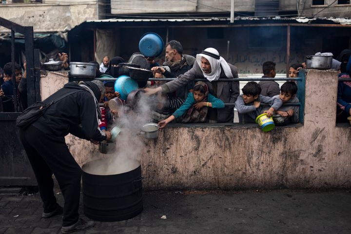 Palestinians line up for a free meal in Rafah, Gaza Strip, on Feb. 16, 2024. International aid agencies say Gaza is suffering from shortages of food, medicine and other basic supplies as a result of the war between Israel and Hamas. 