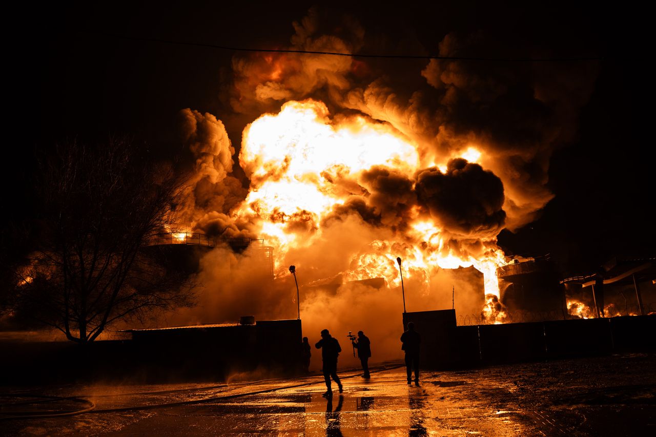 Firefighters extinguish a fire at an oil depot following a Russian kamikaze drones strike on February 10, 2024 in Kharkiv, Ukraine.