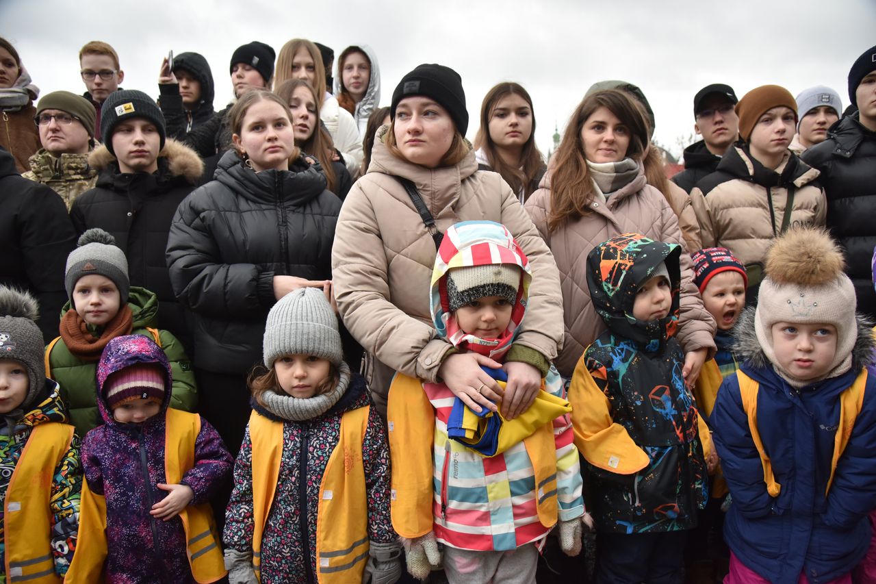 Ukrainians with their children in Lyiv, to the west of the country.