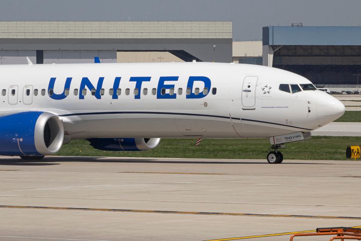 A United Airlines plane is seen taxiing at the Chicago International Airport where a similar plane was forced to make an emergency landing on Wednesday.