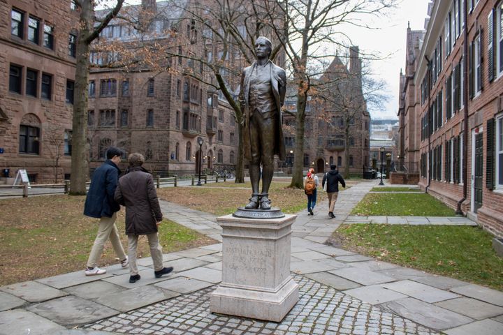 A statue of Nathan Hale, a Yale University class of 1773 graduate, with his hands and ankles bound with rope and the inscription "I only regret that I have but one life to lose for my country" is in front of Hale's former dormitory Connecticut Hall on the college's campus in New Haven, Connecticut, on Monday, Dec. 4, 2023.