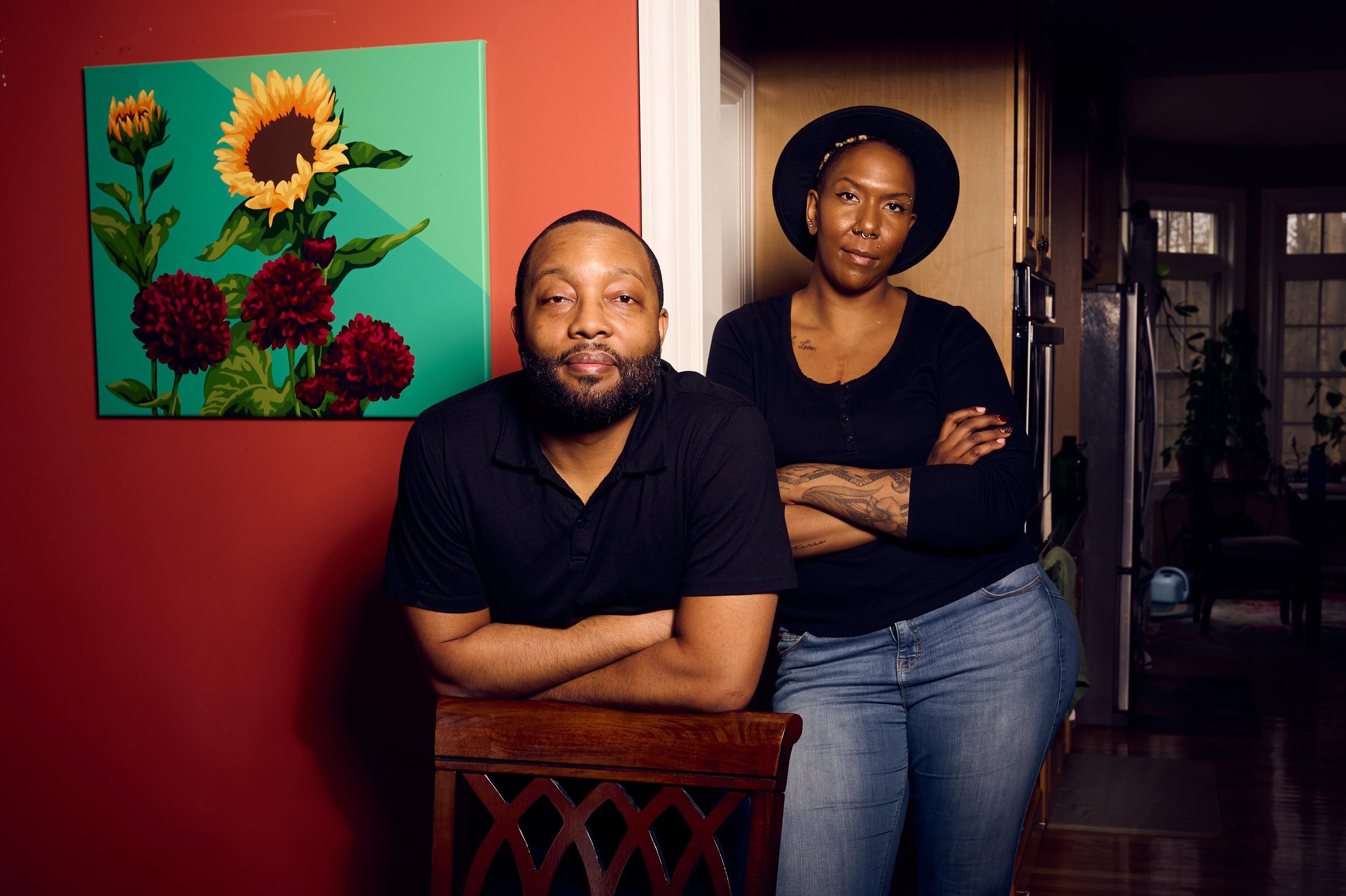 Dr. Jenn M. Jackson and Daren W. Jackson pose for a portrait in their home in Syracuse, New York.