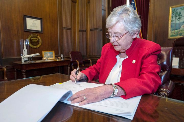 Alabama Gov. Kay Ivey signs a sweeping abortion ban in 2019.