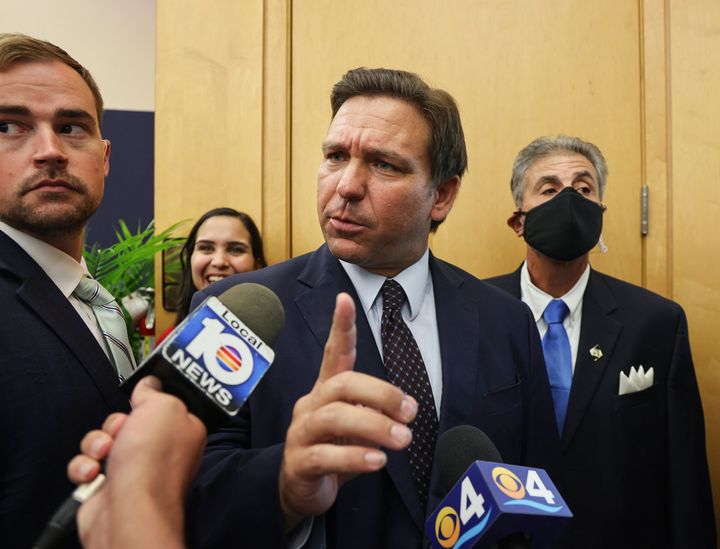 Florida Gov. Ron DeSantis responds to a local TV reporter's question after he signed legislation to make it harder for social media companies to punish users who violate terms of service agreements, on Monday, May 24, 2021.