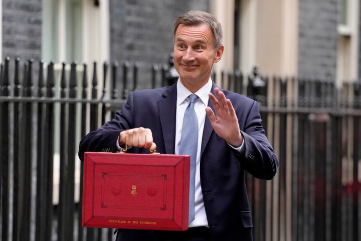 Chancellor of the Exchequer Jeremy Hunt holding his traditional red ministerial box before announcing the 2023 Budget last March.