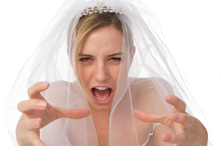 close up of angry bride as a stressful wedding planning or bridezilla concept
