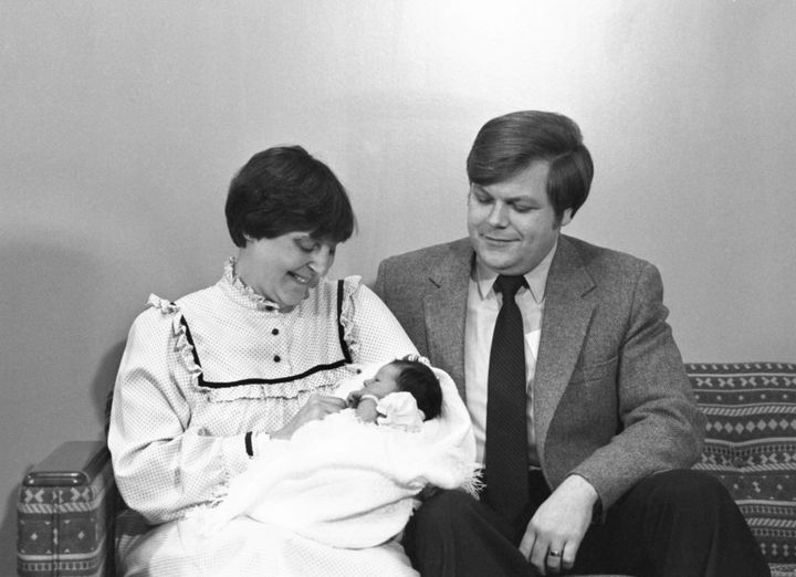 Judith Carr holds her newborn daughter, Elizabeth, alongside her husband, Roger Carr, in 1981.