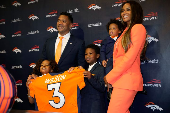 Quarterback Russell Wilson and rapper Ciara with their children Sienna, left, Future Zahir and Win, during his introductory press conference with the Denver Broncos on March 16, 2022, at the team headquarters in Englewood. 