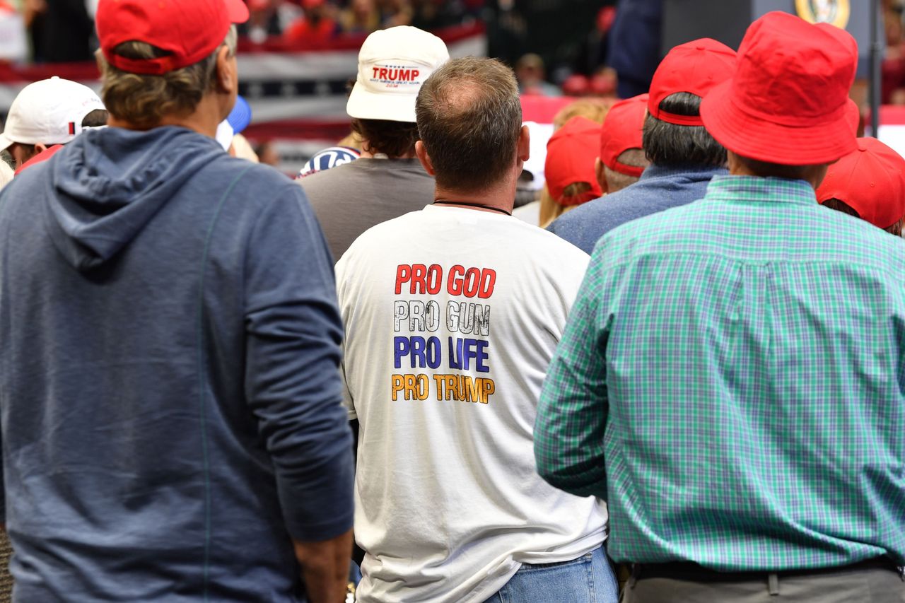 A Trump supporter wears a T-shirt reading pro God, pro gun, pro life, pro Trump during a Keep America Great rally in Dallas, Texas, on Oct. 17, 2019.